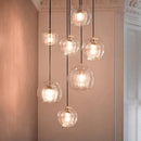 Glass globe pendant light over the island pendant lights