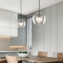 Glass globe pendant light over the island pendant lights